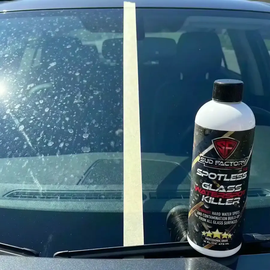 Spotless X2 bottle on a clear car windshield