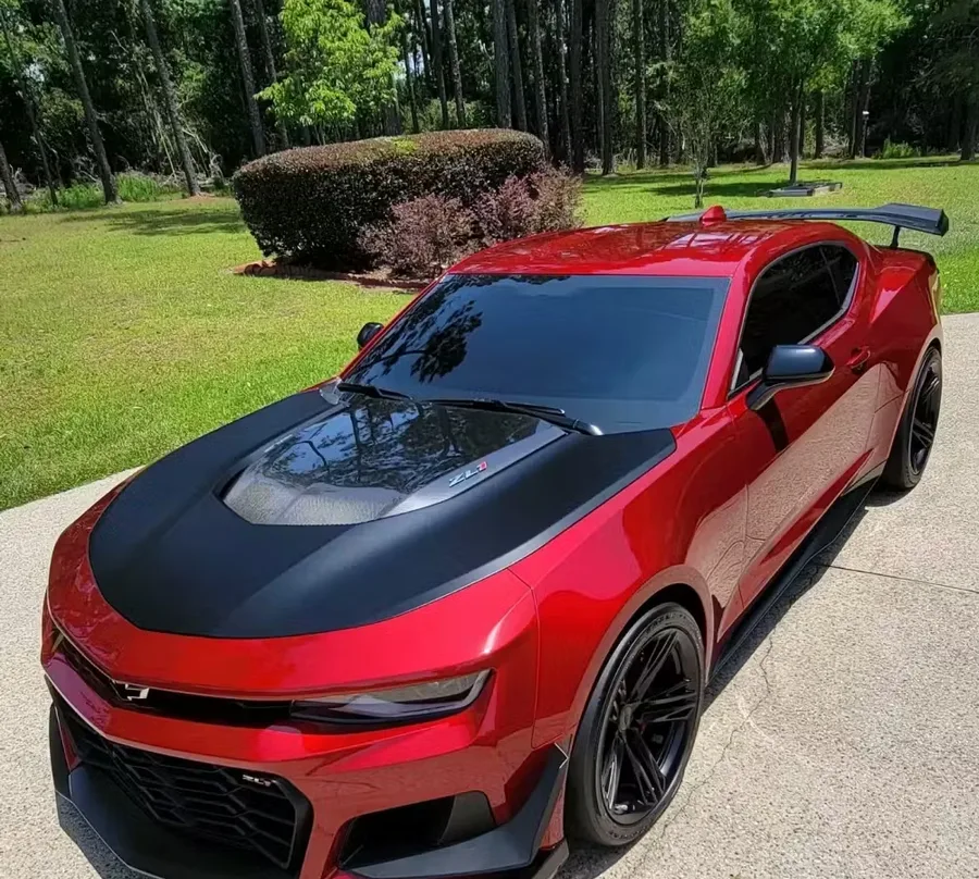 Red car with a deep, glossy paint finish