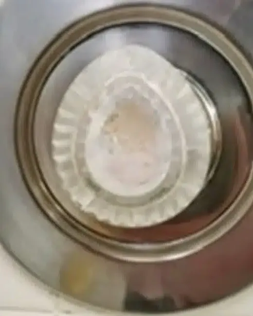Bathroom sink drain after: bright, clean chrome