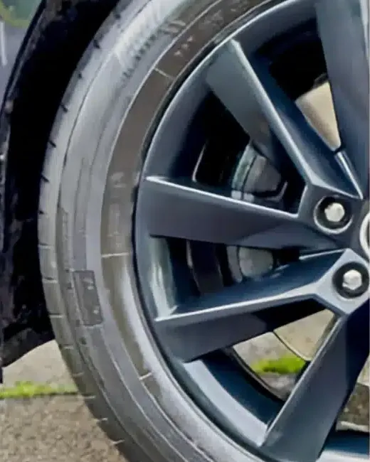 Black alloy wheel after: clean, deep black finish