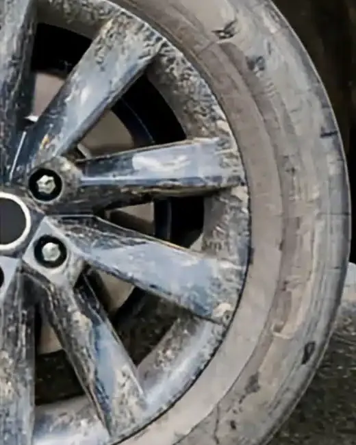 Black alloy wheel before: dull and spotted
