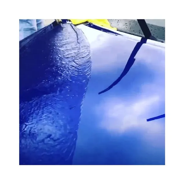 Water sheeting off a blue car coated with SFX1
